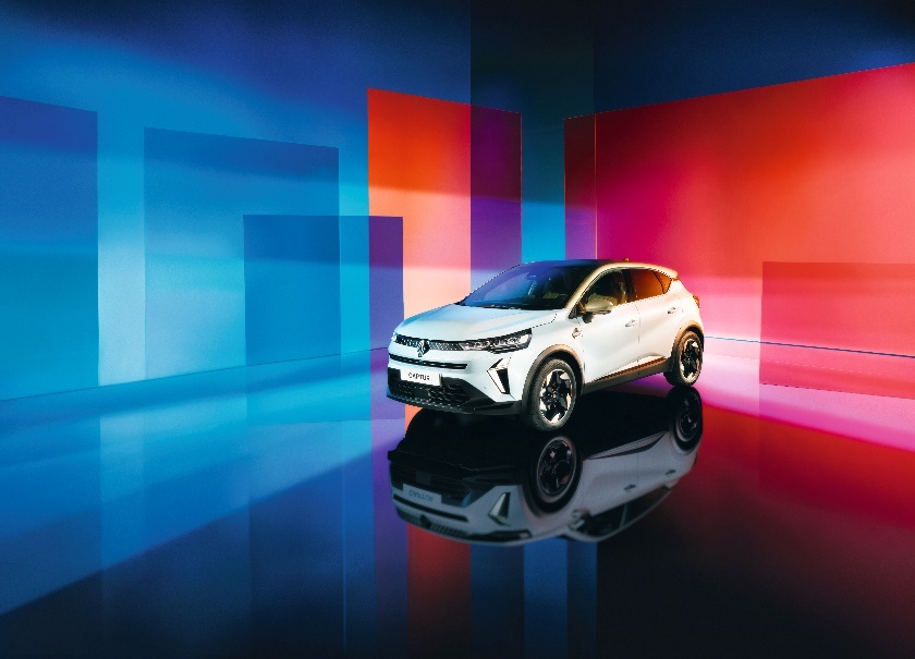 A white car in a room with colorful squares
Description automatically generated